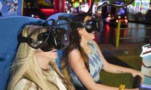 group having fun whilst using a VR amusement arcade