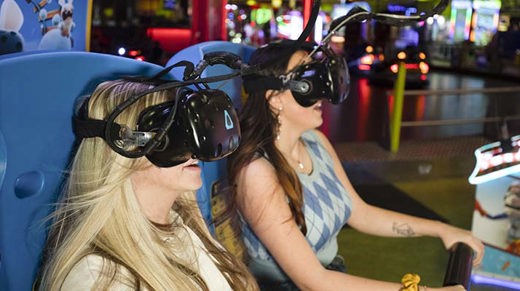 group having fun whilst using a VR amusement arcade