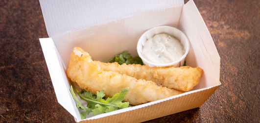Fish goujons with salad and dipping sauce in a takeaway box