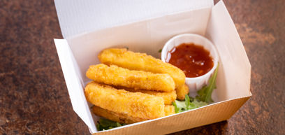 Halloumi sticks served with salad and a dipping sauce in a takeaway box