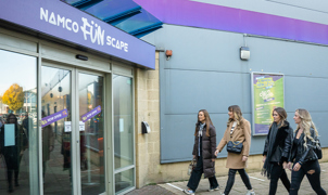 Group of women walking into Namco Funscape Braintree entrance 