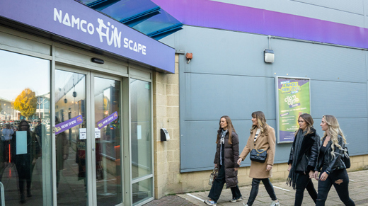 Group of women walking into Namco Funscape Braintree entrance 