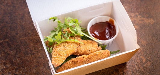 Southern fried chicken pieces in a takeaway box