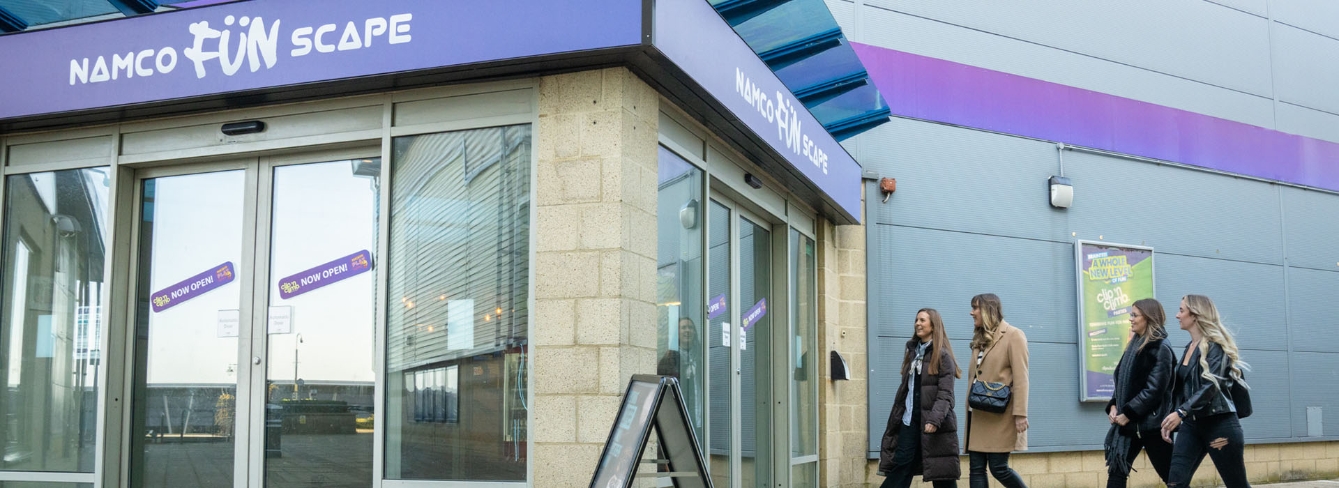 group of friends walking into namco funscape braintree