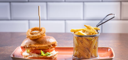 Burger and fries served on a plate