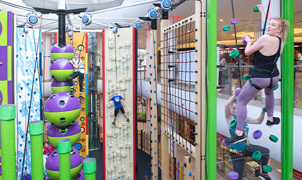 Reach new heights at namco funscape on their clip n climb walls