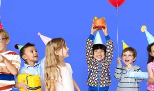 group of children smiling and laughing during a party