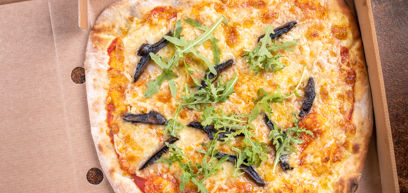 Pizza with Cheddar, Mozzarella, Brie, Parmesan, mushroom, tomato sauce and rocket  in a pizza box