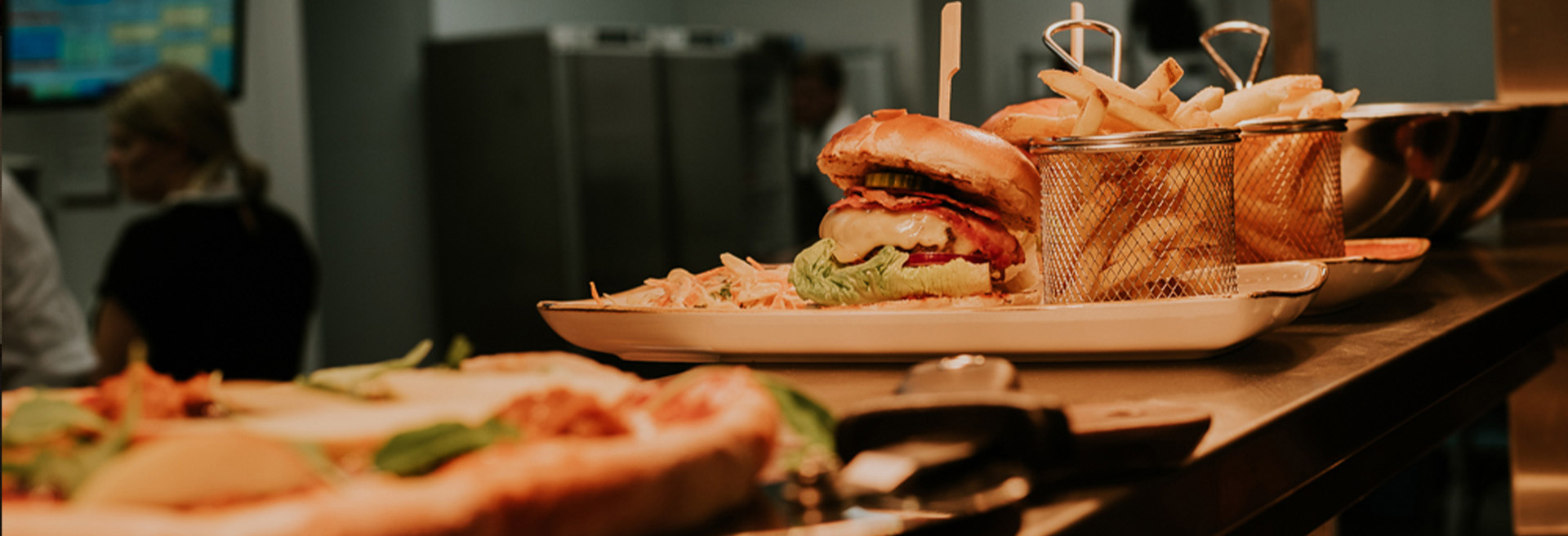 An array of food including pizza, burgers and chips